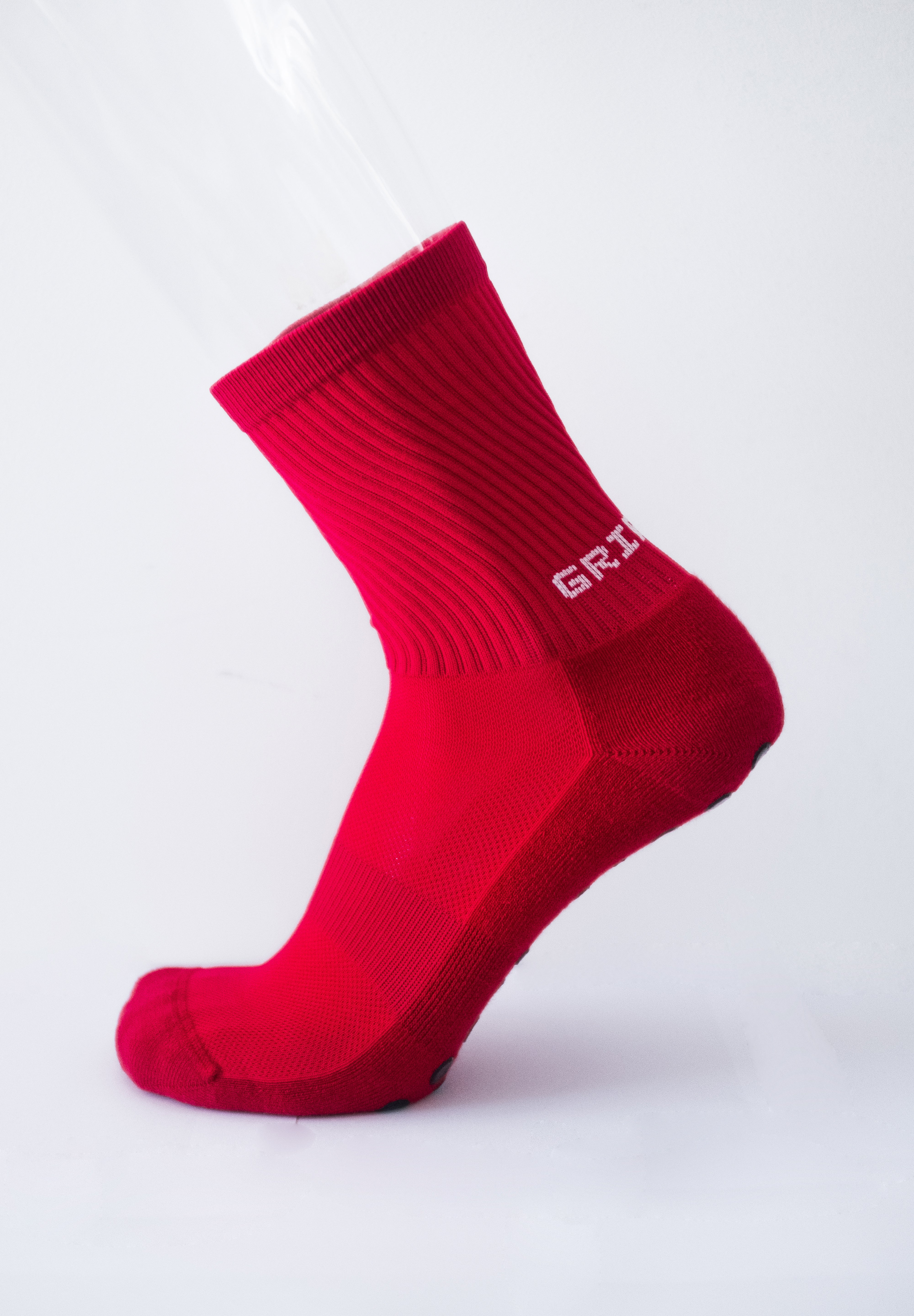 Meias com antiderrapante (grip), na cor vermelho, para desporto como o futebol ou futsal..