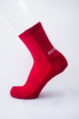 Meias com antiderrapante (grip), na cor vermelho, para desporto como o futebol ou futsal..
