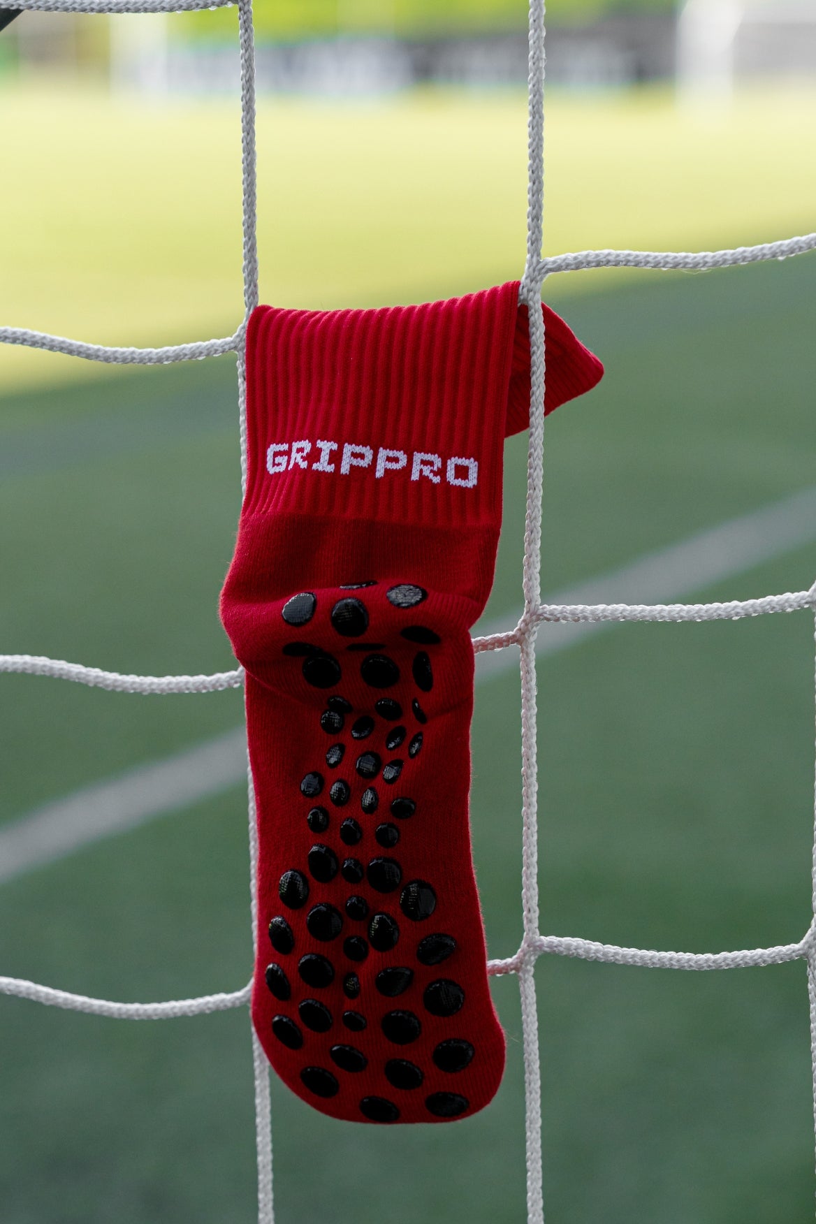 Meias com antiderrapante (grip), na cor vermelho, para desporto como o futebol ou futsal..