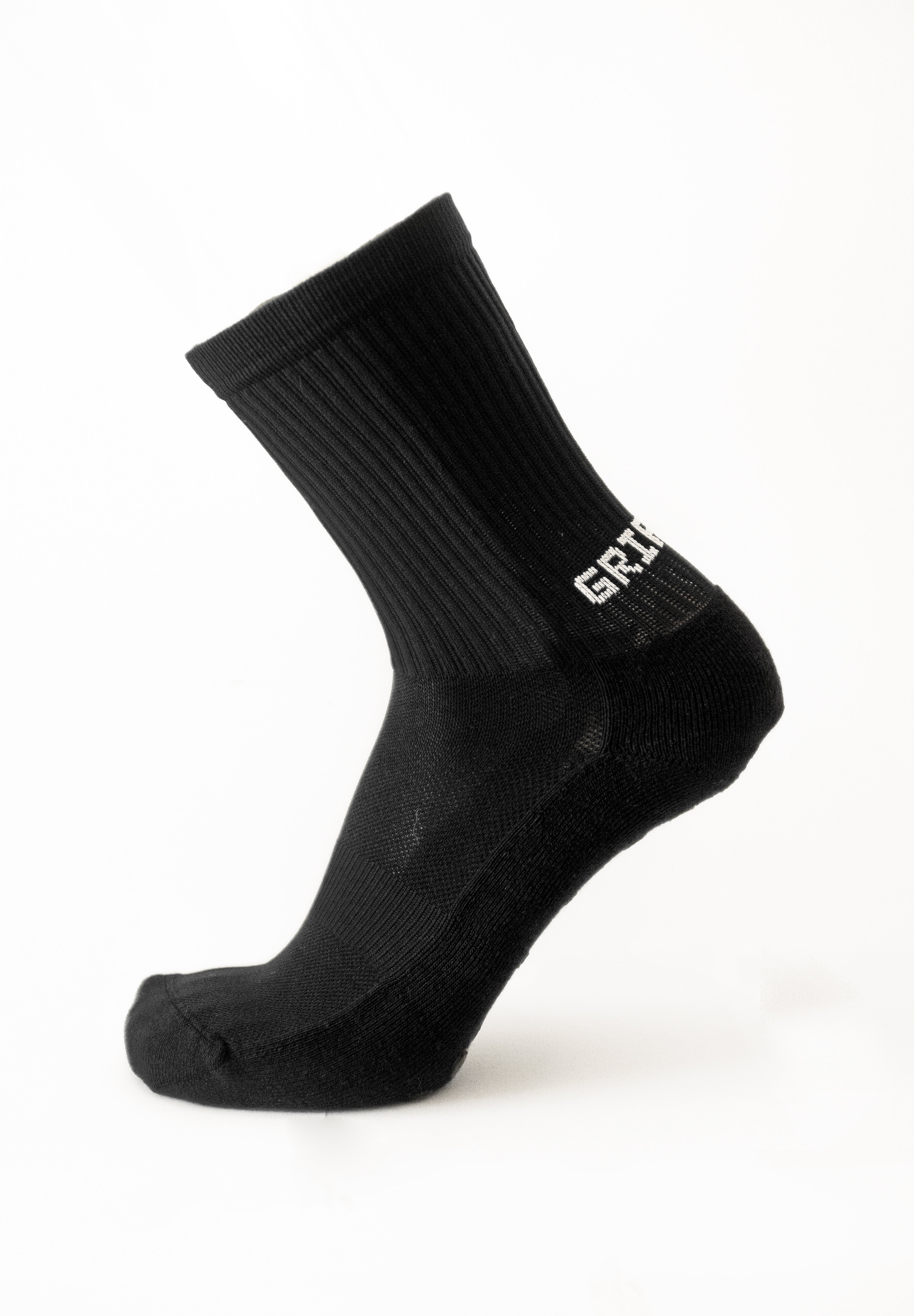 Meias com antiderrapante (grip), na cor preta, para desporto como o futebol ou futsal..