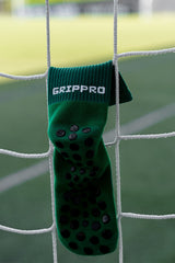 Meias com antiderrapante (grip), na cor verde, para desporto como o futebol ou futsal..