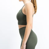 Top de desporto, na cor verde, para mulher. Top com bom suporte no peito. Perfeito para atividades de alto desempenho.